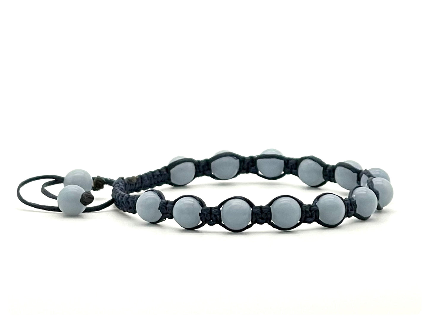 A macrame bracelet made with 6mm angelite beads, crafted from blue cotton waxed cord, adjustable from 17cm to 22cm, suitable for both men and women.